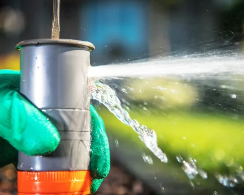 water-sprays-from-a-gray-plastic-repair-joint-2026-03-23-23-49-25-utc